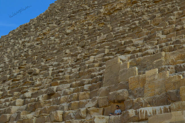 Great pyramid and man meditating 